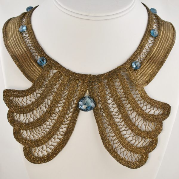 Image of striking unique necklace gold with clear blue stones